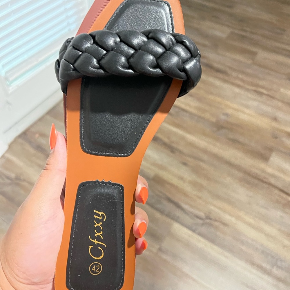 Flat braided leather sandals